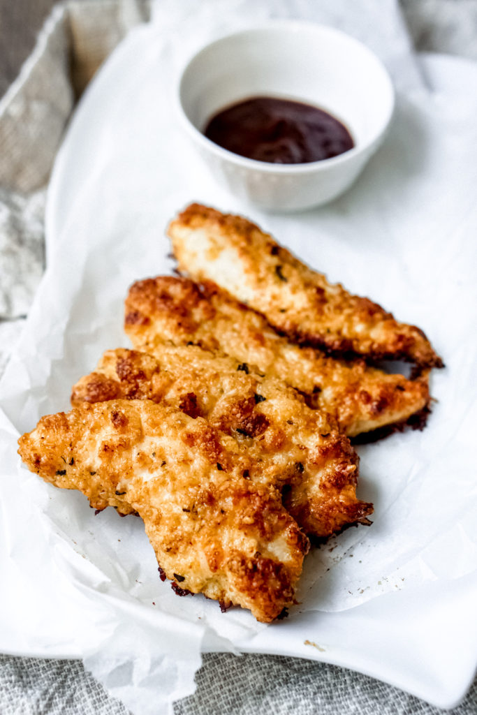 Crispy Chicken Tenders coated with parmesan cheese are high protein and low carbohydrate. Pair these crispy chicken tenders with a salad and a side of healthy carb for a balanced meal.