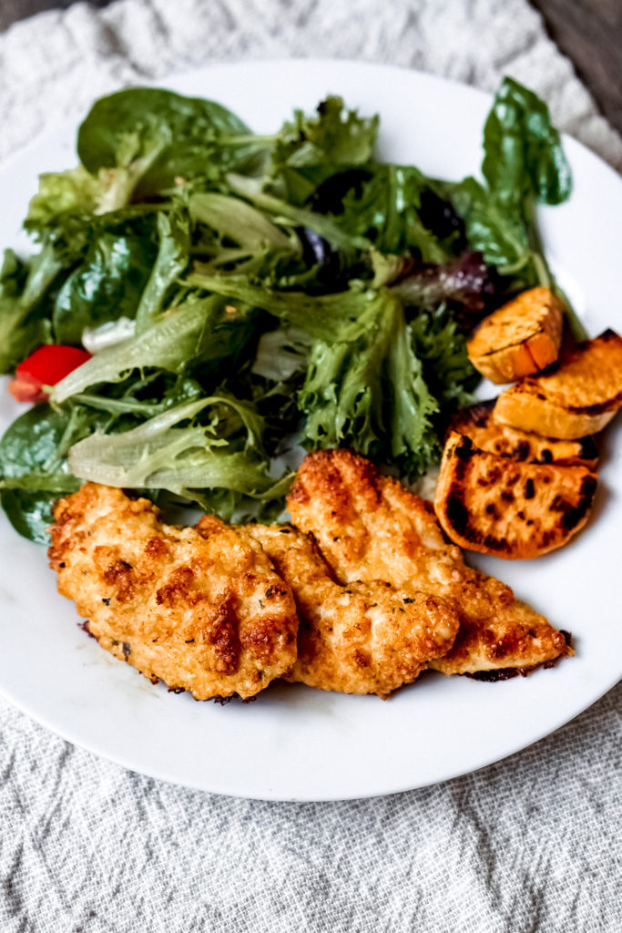 Crispy Chicken Tenders coated with parmesan cheese are high protein and low carbohydrate. Pair these crispy chicken tenders with a salad and a side of healthy carb for a balanced meal.